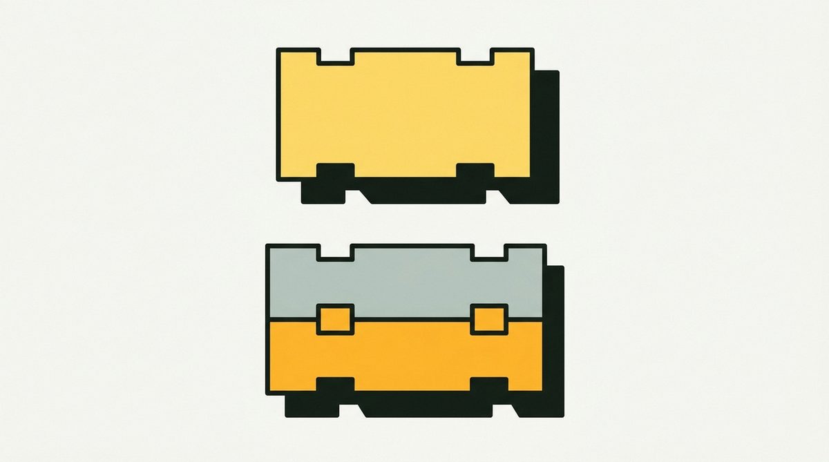 A single chunky brick hovering just above a small stack of two identical bricks, about to be set down.